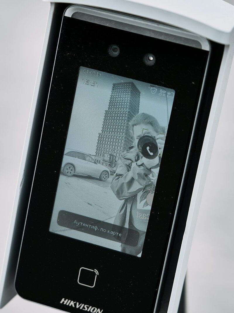 Facial recognition device displaying a black and white image.
